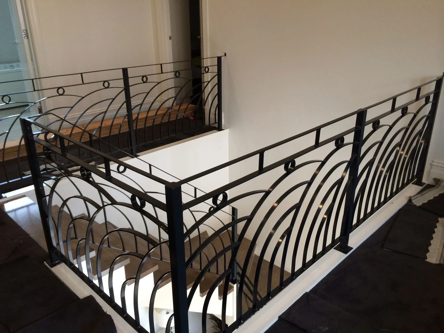 Black wrought iron stair and landing balustrade
